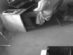 The glamorous wife is caught on camera masturbating beneath her desk.